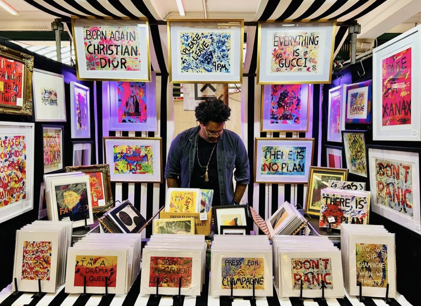 A wall of Luis Alvarez artworks